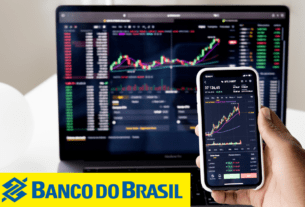 Tela de ações em um monitor e tela de celular
