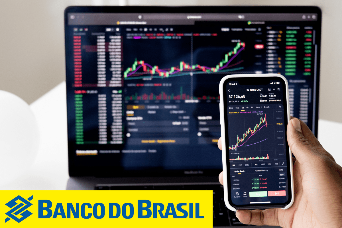 Tela de ações em um monitor e tela de celular
